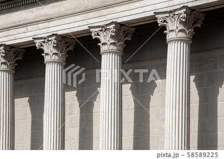 Vintage Old Justice Courthouse Column. Neoclassical colonnade with corinthian columns as part of a 58589225