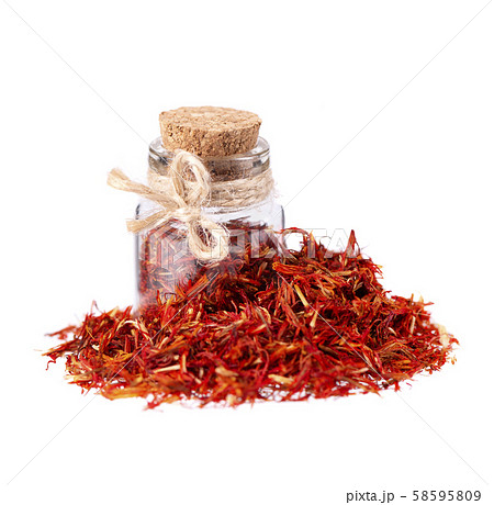 Pile of Saffron in glass jar, isolated on white background. Dried saffron spice. Pile of Saffron in glass jar, isolated on white background. Dried saffron spice. 58595809