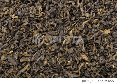 Green tea background. Aromatic green dry tea, close up. 58595855