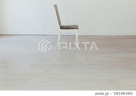 gray chair stands alone in the white room gray chair stands alone in the white room 58596460