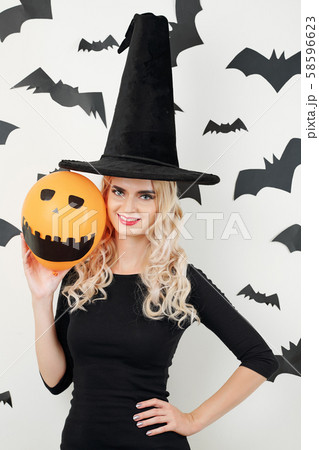 Pretty sorceress with scary orange balloon Pretty sorceress with scary orange balloon 58596623