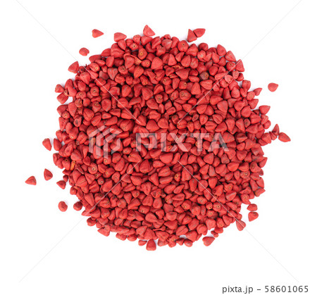 Annatto seeds, isolated on a white background. Achiote seeds, bixa orellana. Natural dye for cooking 58601065