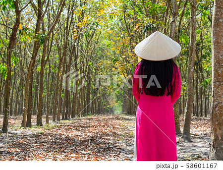 An Asian walking on rural road in Vietnam An Asian walking on rural road in Vietnam 58601167