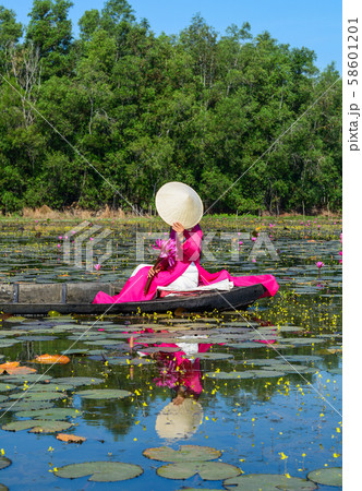 Asian woman on the wooden boat 58601201