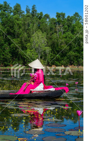 Asian woman on the wooden boat 58601202