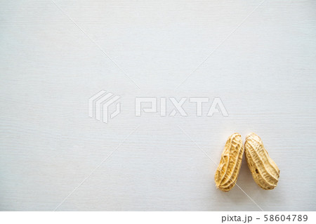 Top view of Two monkey nut or peanut are on the white back ground 58604789