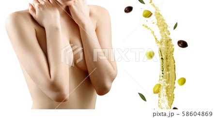 Young beautiful woman looks on splash of olive oil. Young beautiful woman looks on splash of olive oil. 58604869