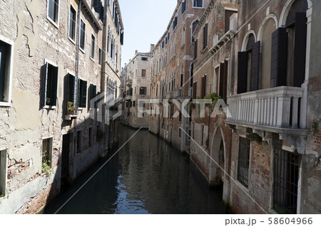 Venice bridge and channel reflections 58604966
