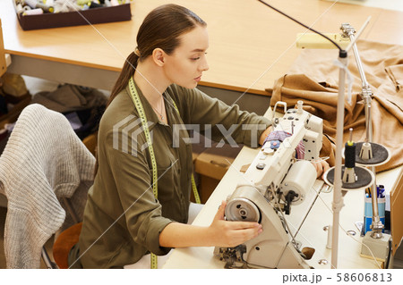 Woman sewing in atelier 58606813