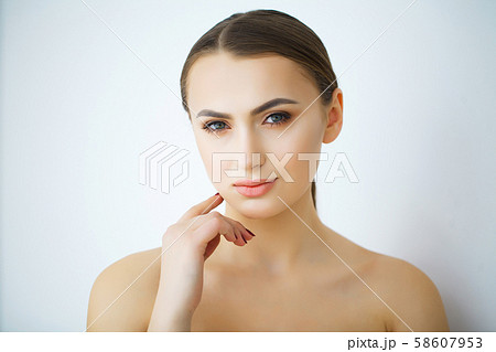 Beautiful face of young woman with health fresh skin Beautiful face of young woman with health fresh skin 58607953