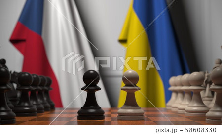 Flags of Czech Republic and Ukraine behind pawns on the chessboard. Chess game or political rivalry Flags of Czech Republic and Ukraine behind pawns on the chessboard. Chess game or political rivalry 58608330