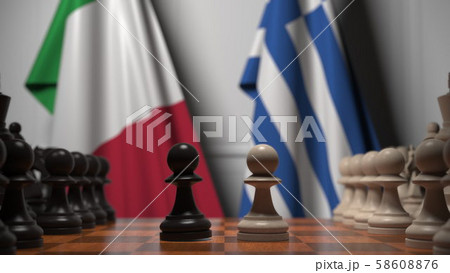 Flags of Italy and Greece behind pawns on the chessboard. Chess game or political rivalry related 3D Flags of Italy and Greece behind pawns on the chessboard. Chess game or political rivalry related 3D 58608876