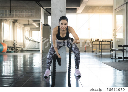 Sporty fit woman workout exercises. Muscular of Sporty fit woman workout exercises. Muscular of 58611070