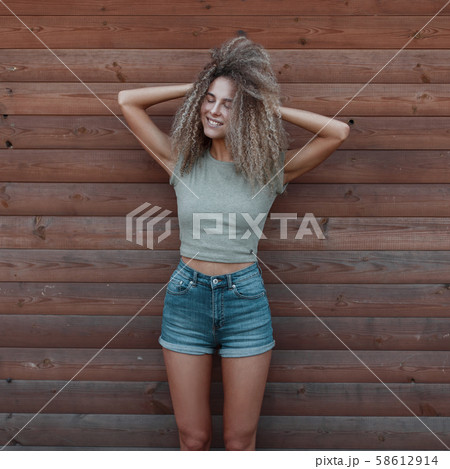 Funny happy hipster woman with curly hair  58612914
