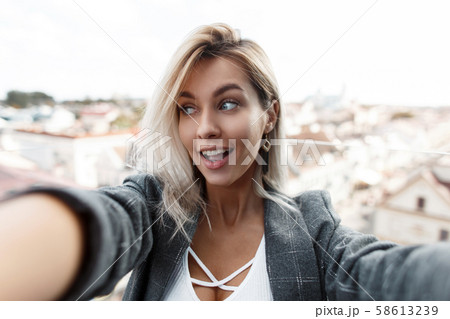 Funny beautiful young woman with a smile Funny beautiful young woman with a smile 58613239