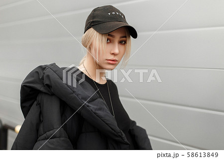 Fashion portrait of a stylish beautiful young girl Fashion portrait of a stylish beautiful young girl 58613849