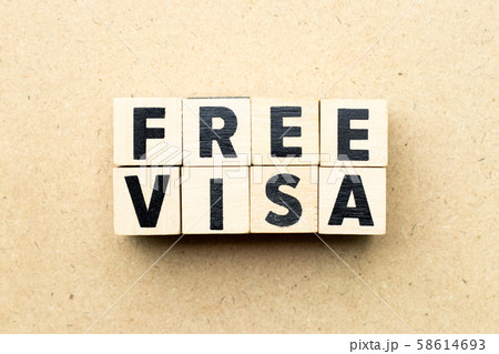 Letter block in word free visa on wood background Letter block in word free visa on wood background 58614693