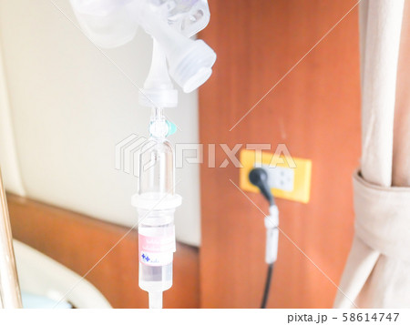 patient in hospital with saline intravenous (iv), saline into the body for treatment 58614747