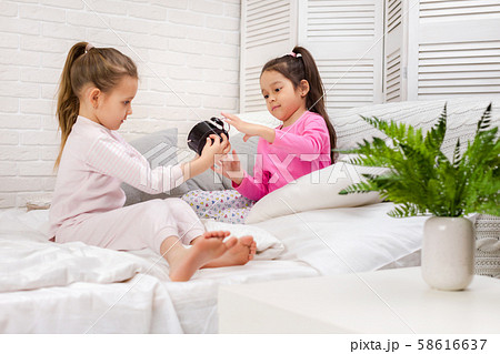 two cute children girls with clock 58616637