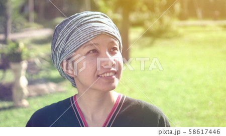 Asian ethnic woman with native dress smile at her Asian ethnic woman with native dress smile at her 58617446