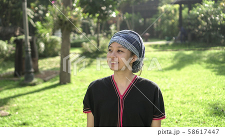 Asian ethnic woman with native dress smile at her 58617447