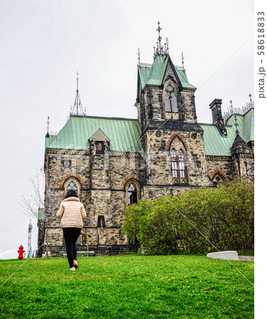 Woman walking at old town Woman walking at old town 58618833