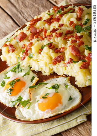 Mashed potato with bacon served with fried eggs Mashed potato with bacon served with fried eggs 58619388
