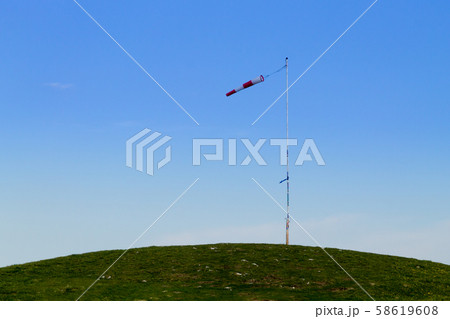 Isolated windsock on blue sky, sport background Isolated windsock on blue sky, sport background 58619608