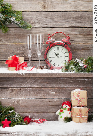 Christmas alarm clock and fir tree branch 58620868