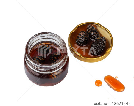 Young pine cones jam in a jar 58621242