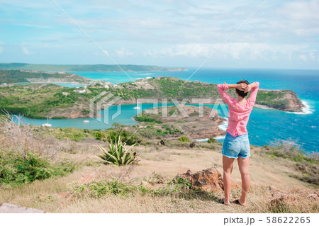 Young woman enjoying breathtaking views of beautiful landscape 58622265