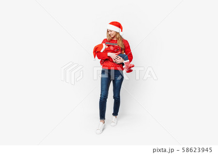Young mother in santa hat with little baby in 58623945