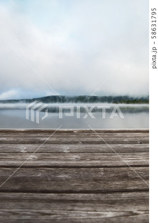 Wooden pier overlooking the morning landscape Wooden pier overlooking the morning landscape 58631795