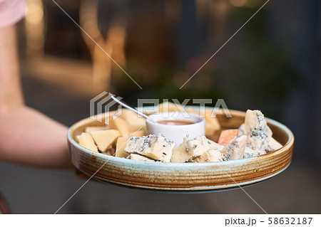 cheese plate in the hands of the chef 58632187