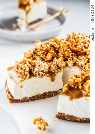 Raw vegan cashew cheesecake with caramel popcorn. 58633124