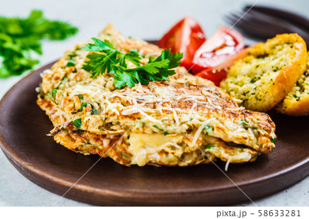 Oatmeal omelette with cheese and herbs.  58633281