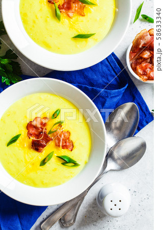 Cheese soup with bacon and green onions 58633340