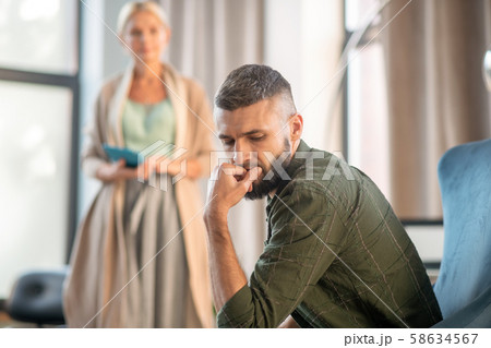 Businessman feeling confused while coming to psychologist 58634567
