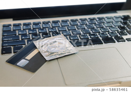 condom on laptop 58635461