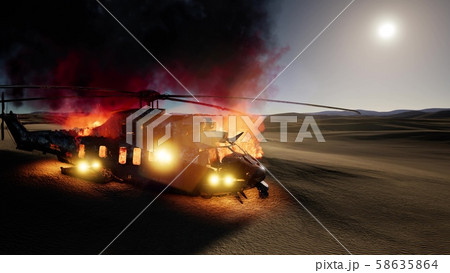 burned military helicopter in the desert at sunset 58635864