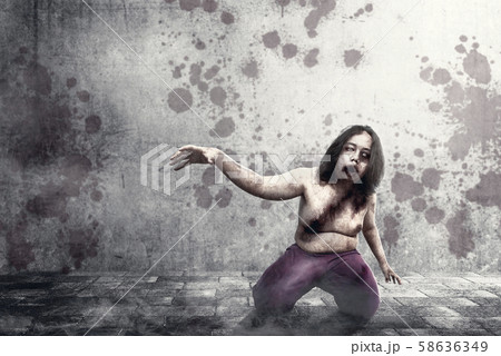 Scary zombies with blood and wound on his body Scary zombies with blood and wound on his body 58636349