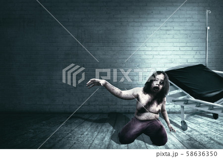 Scary zombies with blood and wound on his body Scary zombies with blood and wound on his body 58636350