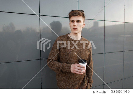 Handsome young stylish man with a hairstyle Handsome young stylish man with a hairstyle 58636449