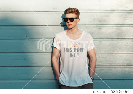 Stylish young man with sunglasses Stylish young man with sunglasses 58636460