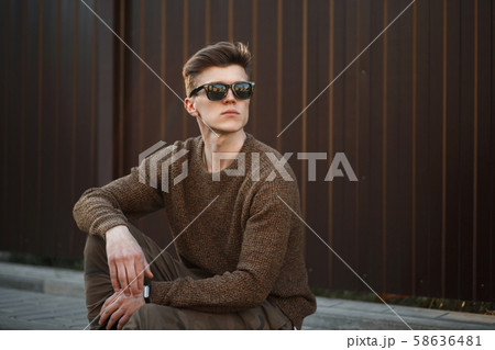 Handsome young stylish guy in fashion clothes 58636481