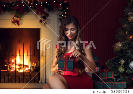 by the fireplace 58636533