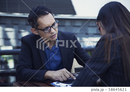 The young woman is stressed from an investment mistake and is blamed by the boss The young woman is stressed from an investment mistake and is blamed by the boss 58645621
