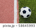 The football is near the line on the artificial 58645993