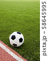 The football is on the artificial grass soccer 58645995