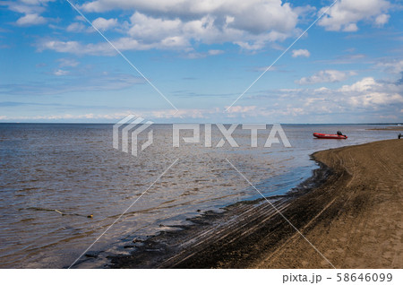 Sand beach with clouds in Urmala. 58646099